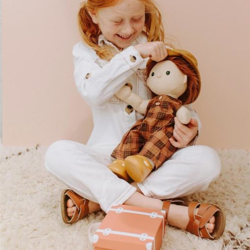 • Suitcase includes a romper, hat, shoes, and activity sticker book • Suitcase is made using thick cardboard, metal clasp and handle • Cotton romper in plaid print with wood buttons • Romper fastens with velcro at the back • Cotton bucket hat • PVC Dinkum Doll shoes • Paper activity sticker book • Made to fit 35cm Dinkum Dolls • Suitable fit for similar sized dolls