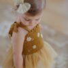 Wild Wawa Mustard Daisy Tutu on cutest baby girl with big cheeks