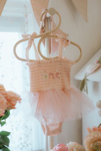 Wild Wawa Pink First Birthday Tutu displayed with roses