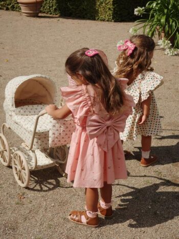 Konges Slojd Evia Bow Dress Cherry Coeur with girls and pram