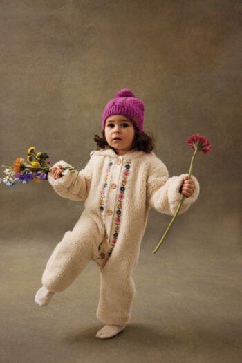 Louise Misha Naglaya Jumpsuit on cute baby dancing