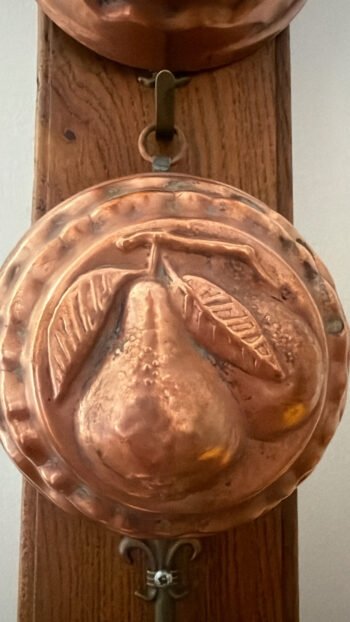 Vintage Copper Fruit Moulds on Wooden Rack Pear