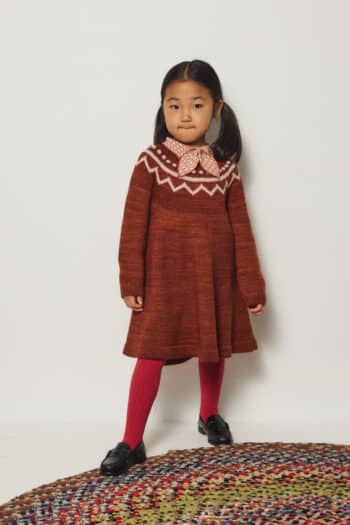 Misha and Puff Junior Scout Top in Candyfloss Little House Floral print organic pima cotton on girl layered with red dress