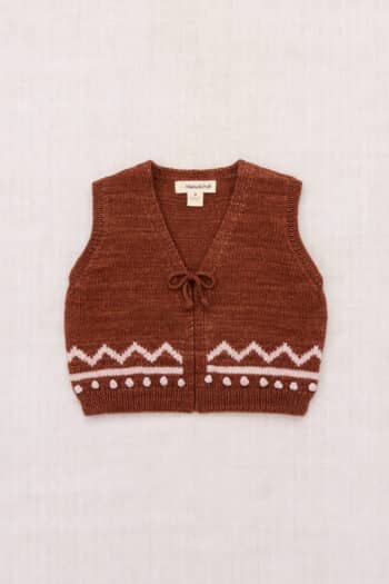 Misha and Puff Zig Zag Vest in Cedar brown hand-knit merino wool featuring a heritage chevron stitch pattern and a classic horn button closure.